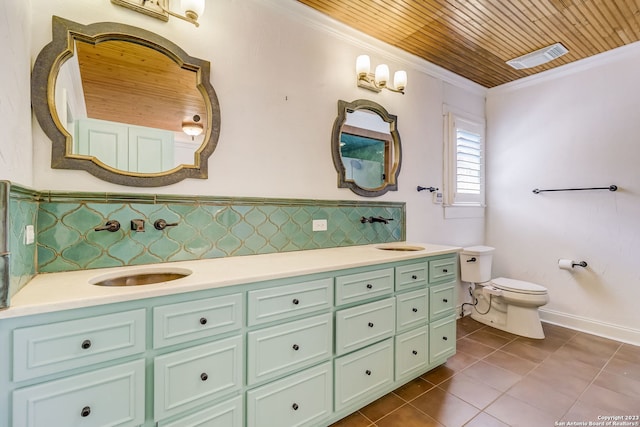 402 Thelma Dr, Olmos Park, TX 78212 - full bath featuring a sink, double vanity, toilet, tile patterned floors, and ornamental molding