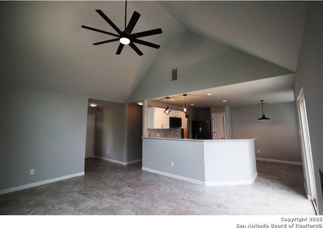 interior space featuring a ceiling fan, visible vents, high vaulted ceiling, baseboards, and recessed lighting