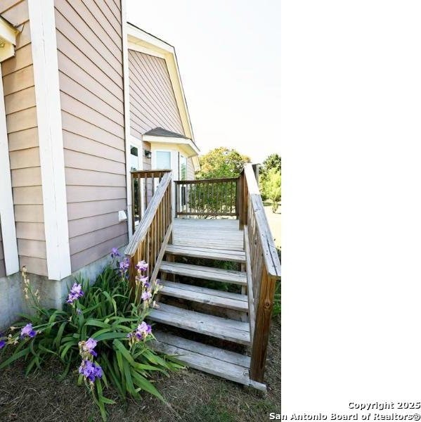 view of exterior entry with a deck