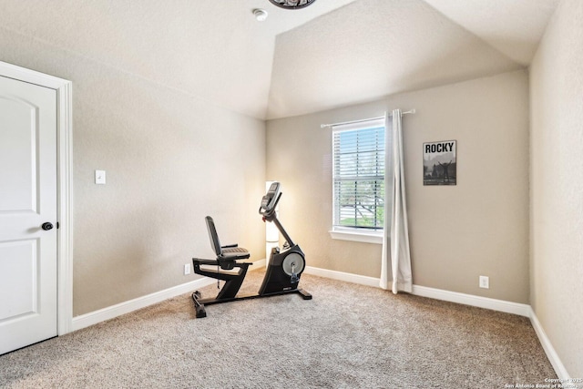 exercise area featuring carpet floors and baseboards