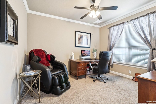 carpeted office space featuring crown molding, baseboards, and a ceiling fan