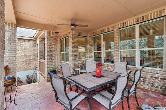 view of patio with a ceiling fan and outdoor dining area