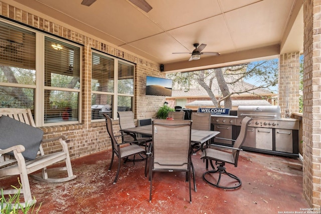 view of patio / terrace with a ceiling fan, outdoor dining space, and area for grilling
