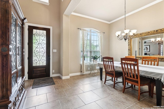 entrance foyer with crown molding, baseboards, an inviting chandelier, and light tile patterned floors