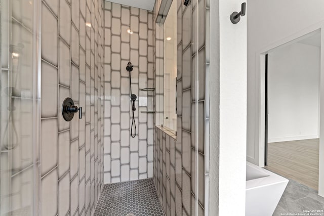full bath featuring tiled shower