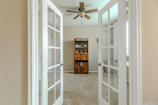 interior space with french doors, carpet flooring, and visible vents