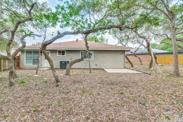 back of property featuring fence