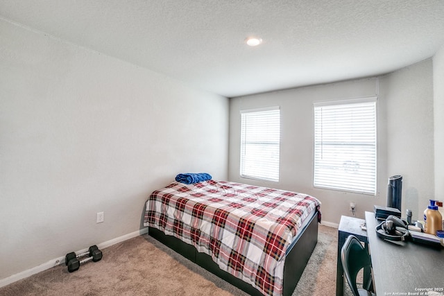 bedroom featuring carpet floors and baseboards