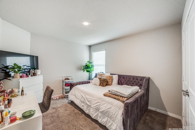 bedroom featuring baseboards and carpet