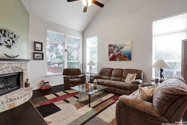3811 Valencia Ct, San Antonio, TX 78259 - living room with ceiling fan, wood finished floors, a fireplace with raised hearth, high vaulted ceiling, and baseboards