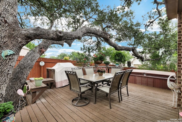 3811 Valencia Ct, San Antonio, TX 78259 - wooden terrace with a covered hot tub, a fenced backyard, outdoor dining space, and grilling area