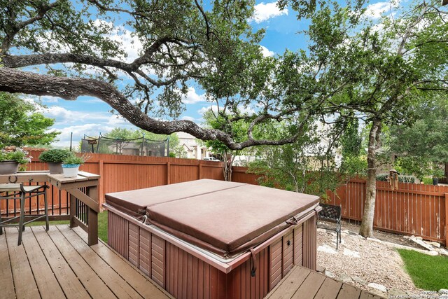 3811 Valencia Ct, San Antonio, TX 78259 - wooden terrace featuring a hot tub and a fenced backyard