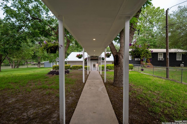 surrounding community featuring a lawn and fence
