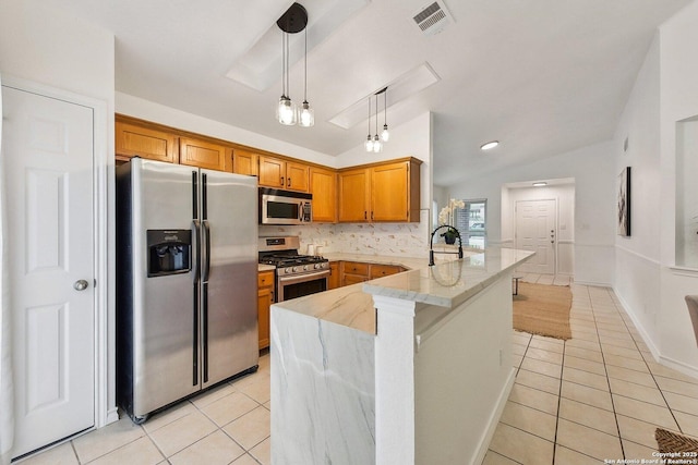 kitchen with light stone counters, stainless steel appliances, a peninsula, light tile patterned floors, and visible vents