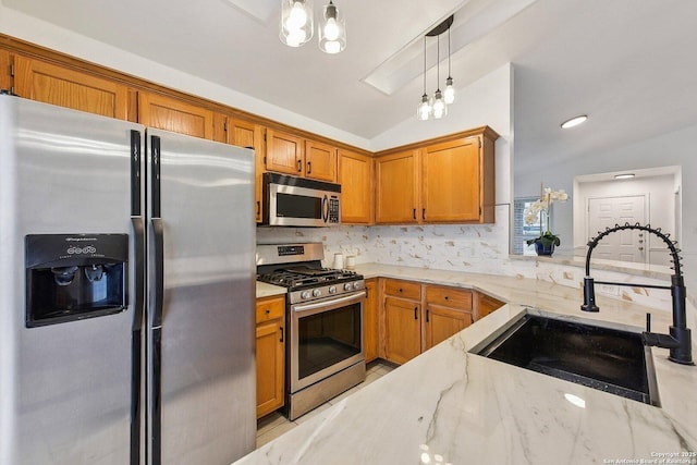kitchen with decorative backsplash, brown cabinets, light stone counters, a sink, and stainless steel appliances