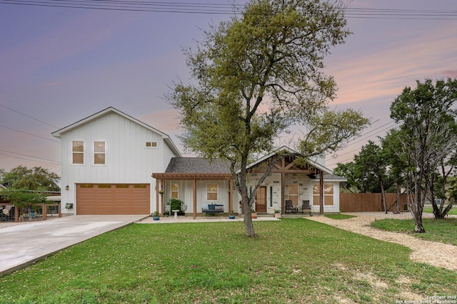 1420 Persimmon Pass, Fischer, TX 78623 - view of front facade with concrete driveway, fence, a front yard, and a garage