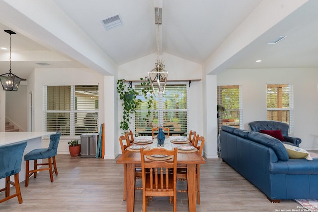 1420 Persimmon Pass, Fischer, TX 78623 - dining space featuring visible vents, baseboards, lofted ceiling with beams, a chandelier, and light wood-style flooring