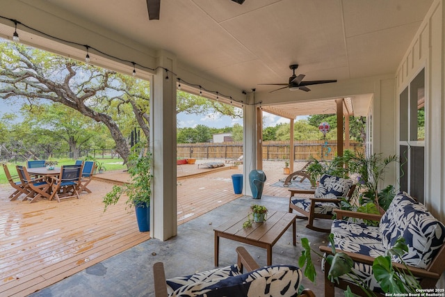 1420 Persimmon Pass, Fischer, TX 78623 - deck with a fenced backyard, a ceiling fan, and outdoor dining space