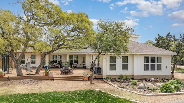 1420 Persimmon Pass, Fischer, TX 78623 - rear view of house featuring board and batten siding, a wooden deck, and a shingled roof