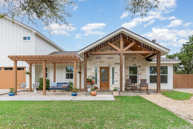 1420 Persimmon Pass, Fischer, TX 78623 - back of house featuring a lawn, a pergola, fence, and stone siding