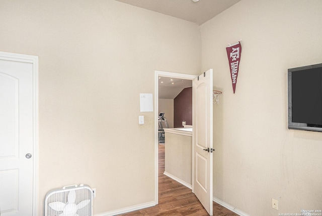 unfurnished bedroom with baseboards and wood finished floors