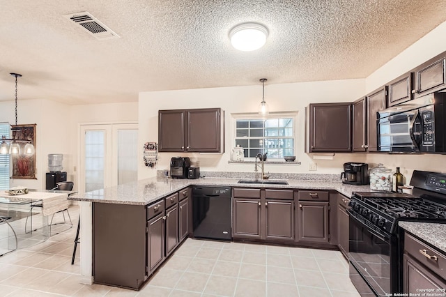 kitchen with visible vents, a peninsula, a sink, light tile patterned floors, and black appliances