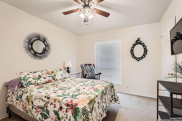 carpeted bedroom featuring baseboards, a textured ceiling, and multiple windows