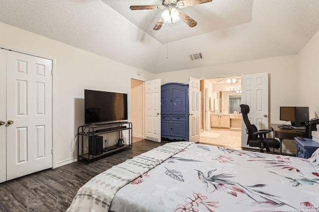 bedroom with ceiling fan, ensuite bath, baseboards, dark wood-type flooring, and visible vents