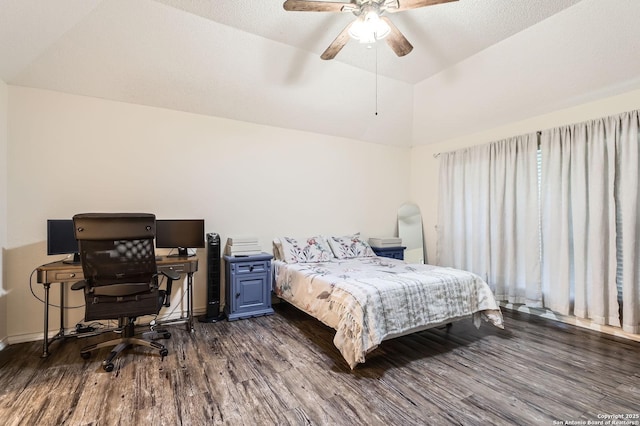 bedroom with baseboards, dark wood finished floors, ceiling fan, and vaulted ceiling