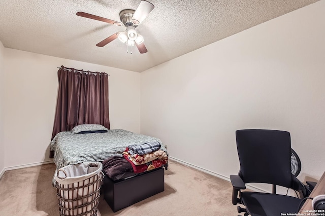 bedroom with light colored carpet, a textured ceiling, ceiling fan, and baseboards