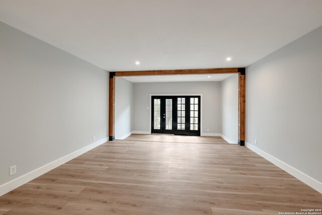 66 Brees Blvd Unit 125, San Antonio, TX 78209 - unfurnished room featuring baseboards, light wood-type flooring, and recessed lighting