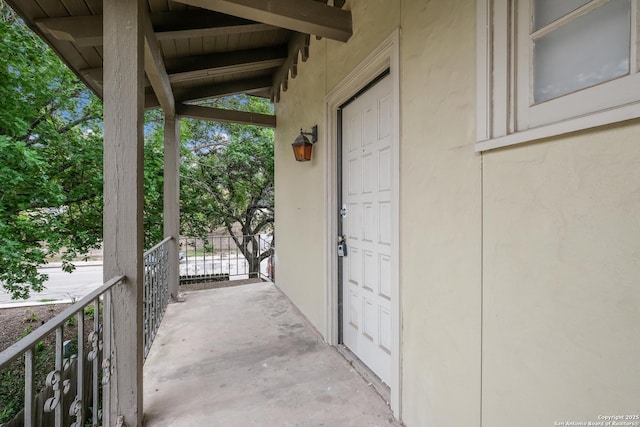 66 Brees Blvd Unit 125, San Antonio, TX 78209 - doorway to property with stucco siding and a porch