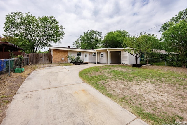 5154 Village Grn, San Antonio, TX 78218 - ranch-style home with fence, concrete driveway, a front yard, and brick siding