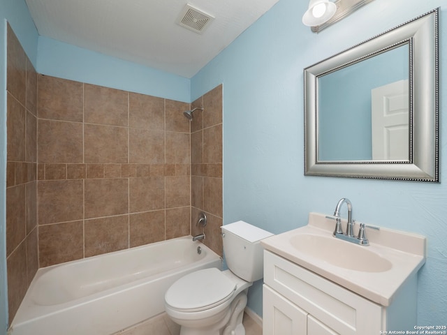 1136 Kentucky Ave, San Antonio, TX 78201 - full bathroom featuring visible vents, washtub / shower combination, toilet, and vanity