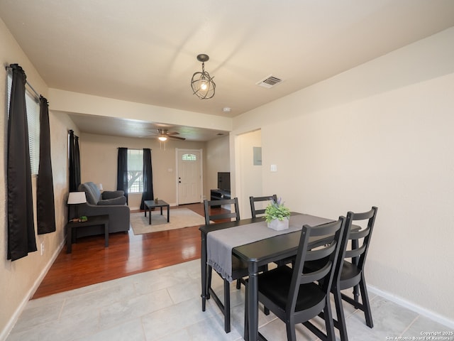 1136 Kentucky Ave, San Antonio, TX 78201 - dining room with visible vents, a ceiling fan, baseboards, and light tile patterned floors