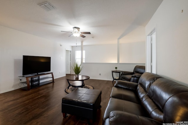 living room with visible vents, a ceiling fan, dark wood-style flooring, and baseboards