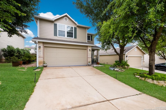 traditional home with a garage, driveway, a front lawn, and brick siding