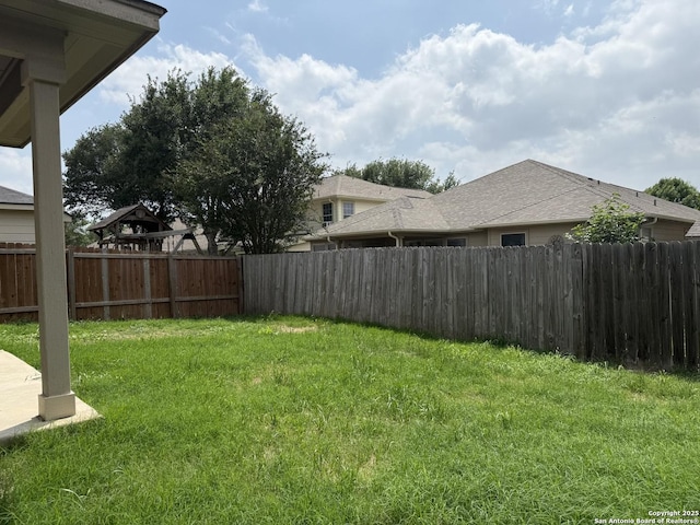 view of yard with a fenced backyard