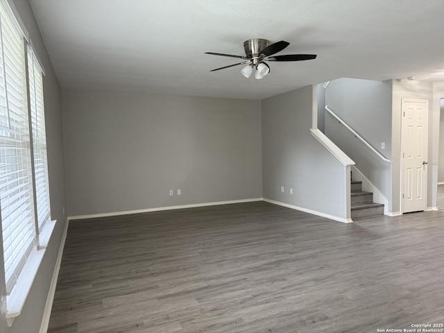 unfurnished living room with ceiling fan, plenty of natural light, and wood finished floors