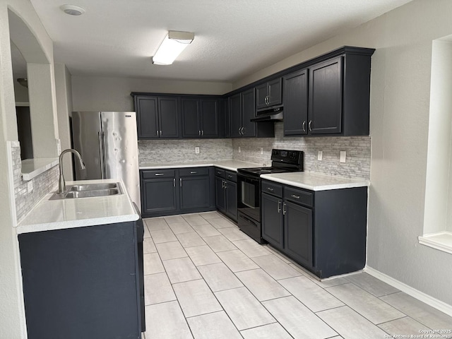 kitchen with a sink, tasteful backsplash, under cabinet range hood, and black range with electric cooktop