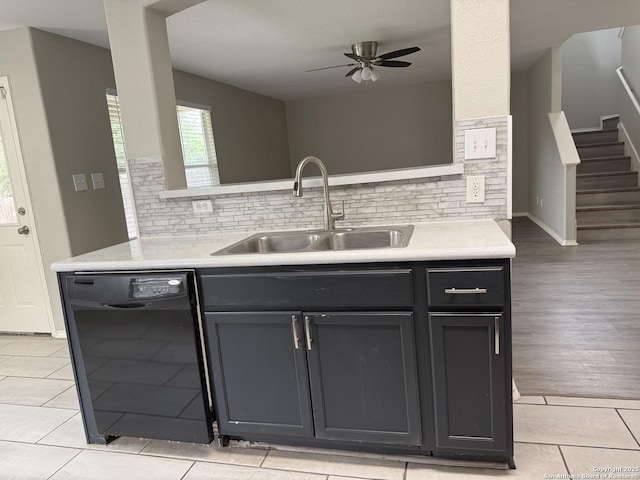 kitchen featuring light countertops, ceiling fan, a sink, and dishwasher