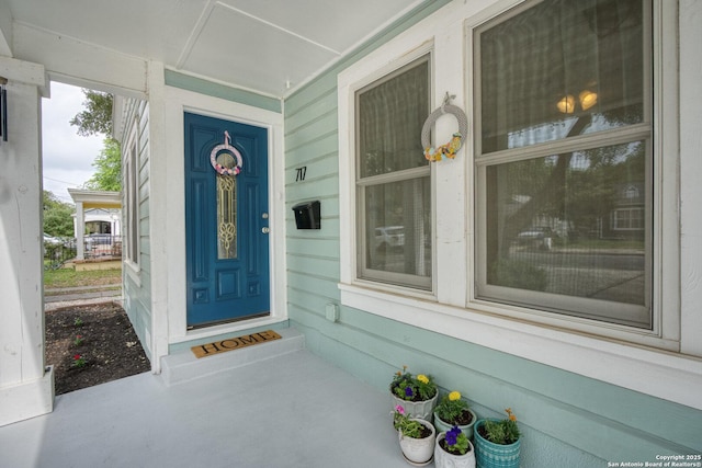 entrance to property featuring a porch