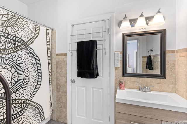 bathroom with tile walls and vanity