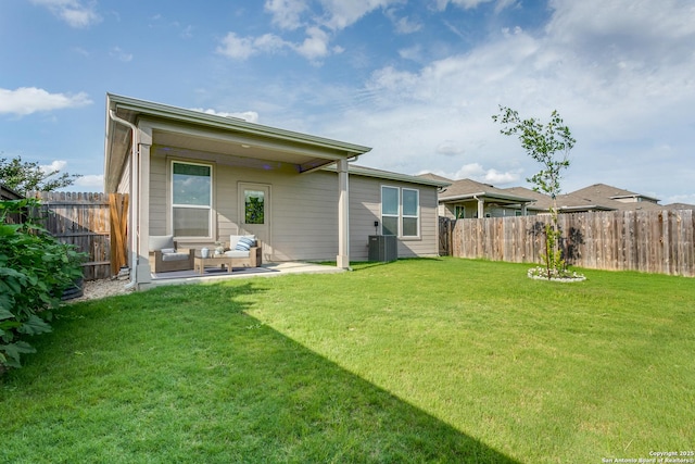rear view of house featuring a fenced backyard, an outdoor hangout area, a yard, and a patio area