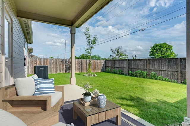 view of yard with a patio, central AC unit, and a fenced backyard