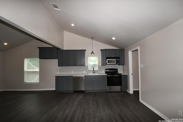1213 W Southcross, San Antonio, TX 78211 - kitchen featuring visible vents, stainless steel appliances, dark wood-style flooring, and lofted ceiling
