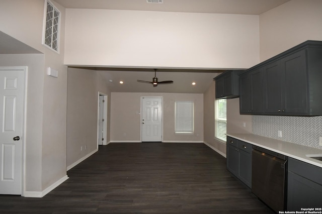 1213 W Southcross, San Antonio, TX 78211 - kitchen with dark wood-style flooring, dishwasher, light countertops, baseboards, and visible vents