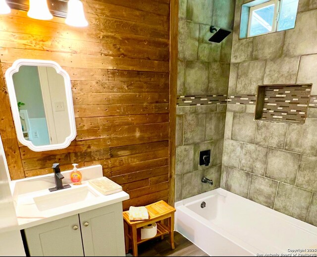 667 Ellor, San Antonio, TX 78228 - full bathroom featuring vanity, wood walls, and shower / washtub combination