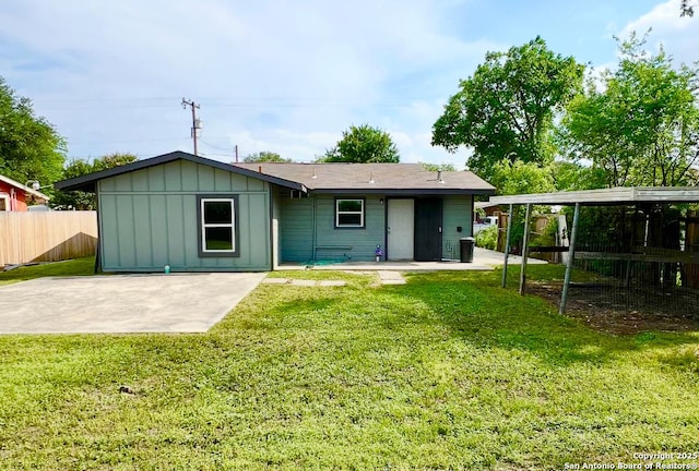 667 Ellor, San Antonio, TX 78228 - rear view of property featuring a lawn, fence, board and batten siding, and a patio area