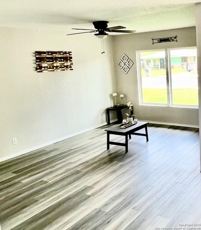 667 Ellor, San Antonio, TX 78228 - living room with baseboards, a ceiling fan, and wood finished floors
